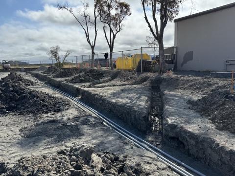 Electrical conduit in a trench.